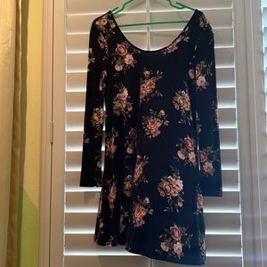 Black and floral flow dress. Mid thigh and long sleeve.